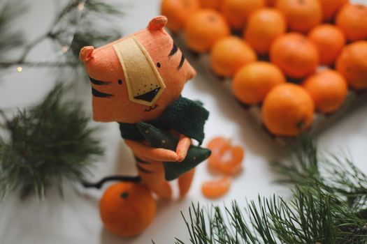 tangerines and tiger toy - symbol of 2022