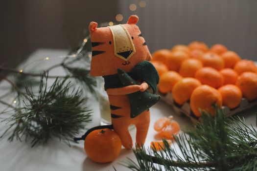 tangerines and tiger toy - symbol of 2022
