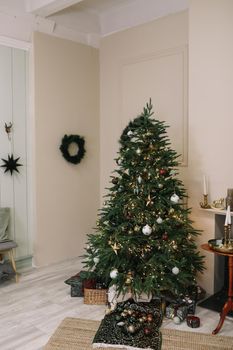 Stylish Christmas interior decorated in rustic style. Handmade festive decorations. Home family comfort. High quality photo