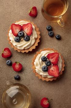 Mini tart with cream cheese and berries top view