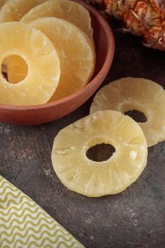 Dried Sweet Pineapple on a dark background