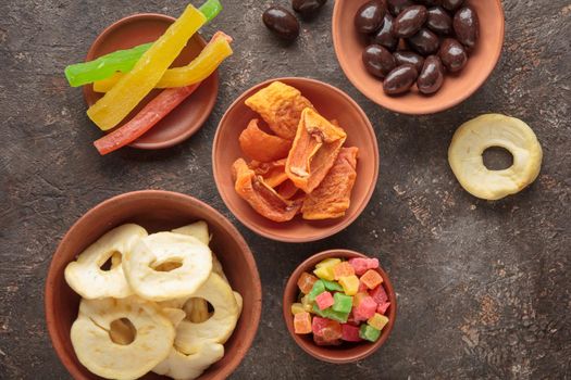 Dried Sweet Fruits on a dark brown background