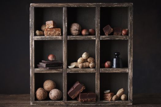 Assorted chocolate sweets in a dark box