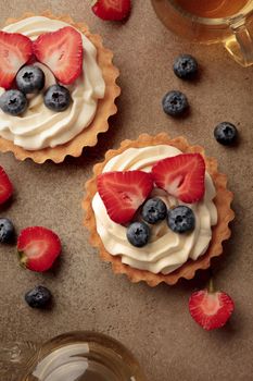 Mini tart with cream cheese and berries top view