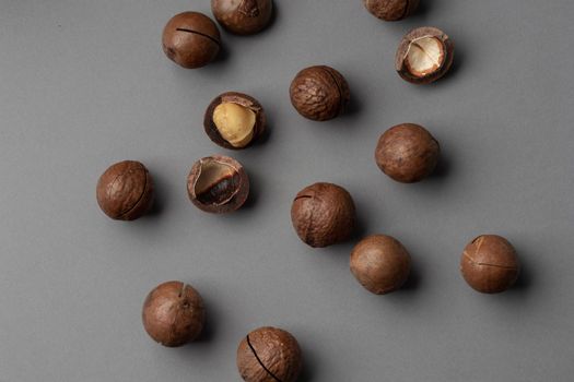 Macadamia nuts on a grey background top view