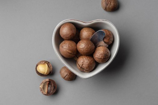 Macadamia nuts on a grey background top view