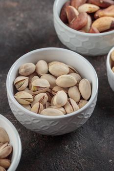 Organic pistachios on a dark background macro