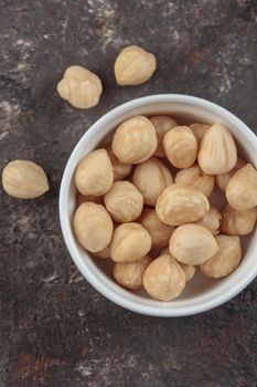 Organic hazelnut on a dark background macro