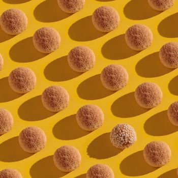Sweet candies pattern on a yellow top view