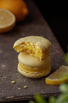 Lemon macaroons on a dark background macro