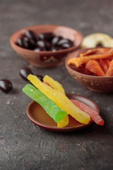 Dried Sweet Fruits on a dark brown background