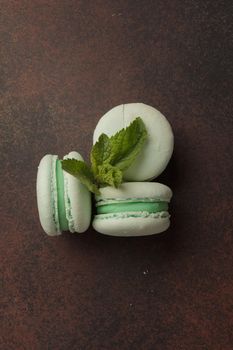 Delicious green macaroons with mint copy space