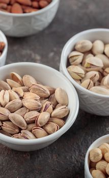 Organic pistachios on a dark background macro