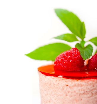 fresh raspberry cake mousse dessert round shape with mint leaves