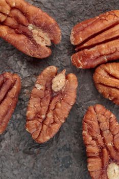 Organic penan nuts on a dark background macro