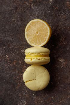 Lemon macaroons on a dark background macro