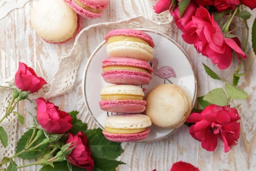 Colorful pink and yellow macaroons on the table