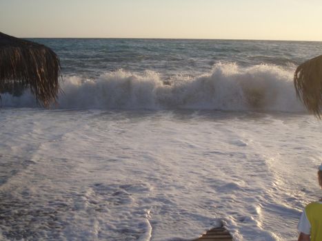 Storm at sea, storm warning on the coast. Big sea waves during a storm.