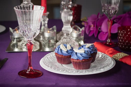 Pink and purple decoration and cupcakes on the table