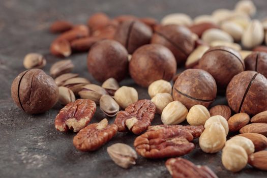 Assorted nuts macro on a dark background