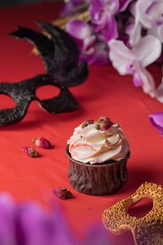 Pink and purple decoration and cupcakes on the table