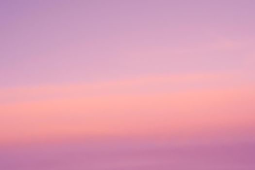 Background of sunrise sky with gentle colors of soft clouds. Dawn sky with colorfull clouds. Daybreak sky.