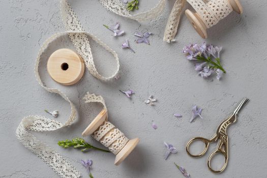 Spring Grey Background with flowers and ribbons on a gray background