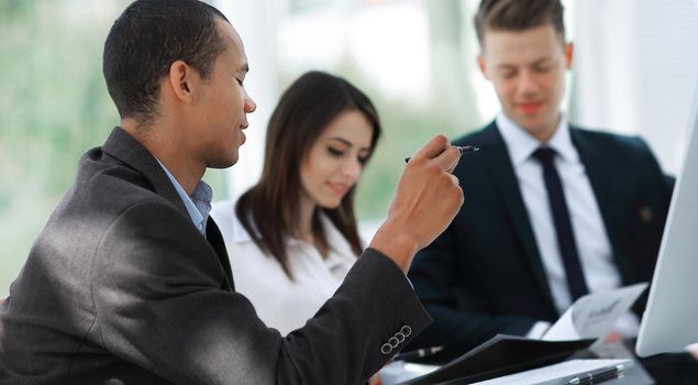 employees discussing new ideas in a modern office.the concept of teamwork