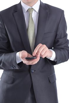 close up. businessman typing SMS on smartphone.people and technologies
