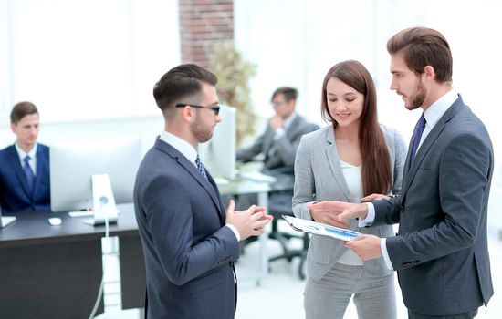 Business woman showing diagram and explaining information to entrepreneur