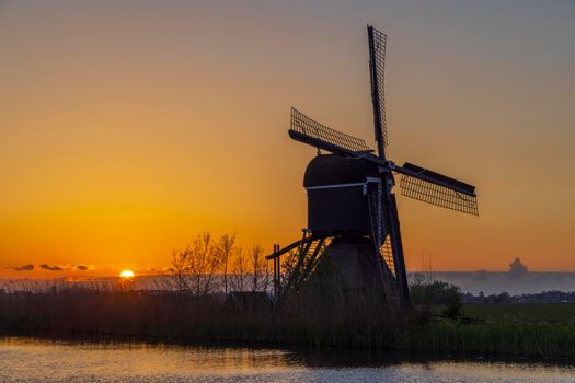 Sunset with windmill Broekmolen, Molenlanden - Nieuwpoort, The Netherlands