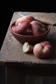 Peaches on an old rustic table Vertical