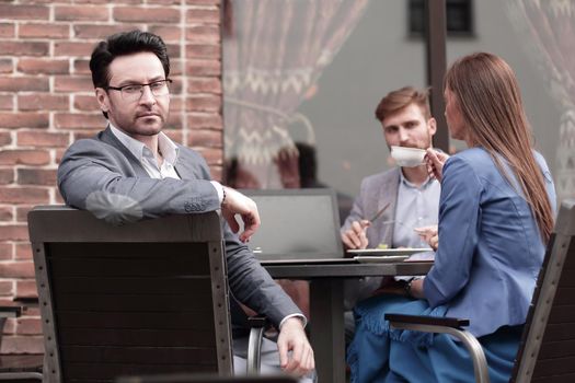 modern businessman on the background of the cafe.lunch break