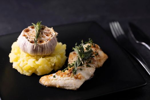 cod fillet with couscous and roasted garlic
