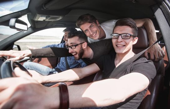 Group Of Friends In Car On Road Trip . joint trip