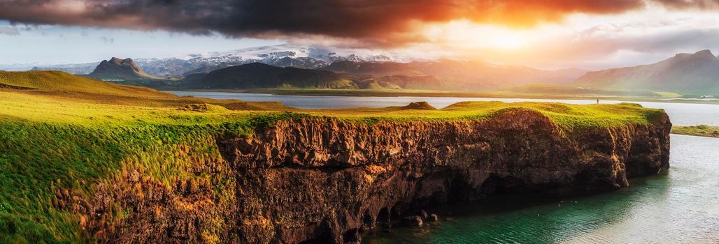 Reynisfjara black sand beach in Iceland. Reynisfyal Mountains.