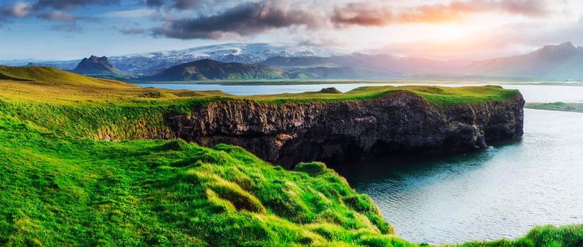 Reynisfjara black sand beach in Iceland. Reynisfyal Mountains.