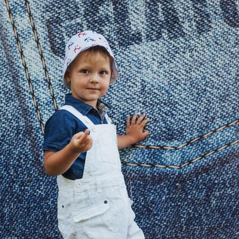 Cute boy posing for photo outdoors Ukraine. Europe.