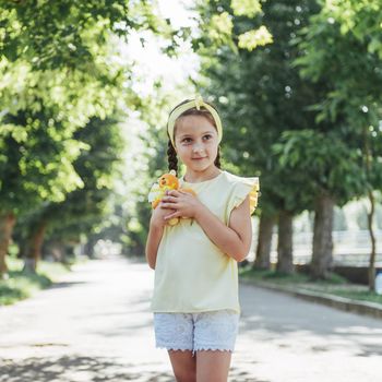 Beautiful girl in a summer sunny day.