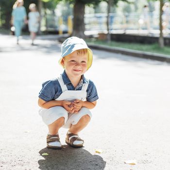 Cute boy posing for photo outdoors. Ukraine. Europe