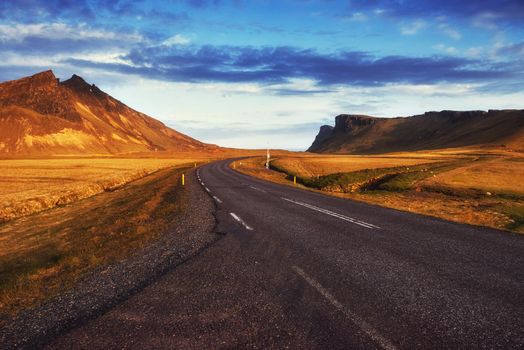 Asphalt road to the mountains. Beauty world. Iceland