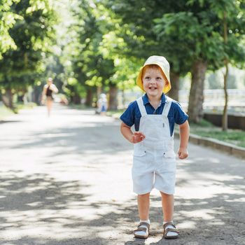 Cute boy posing for photo outdoors. Ukraine Europe.