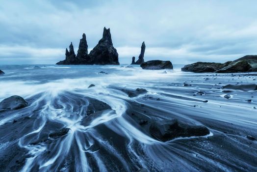 The Rock Troll Toes. Reynisdrangar cliffs. Black sand beach Iceland
