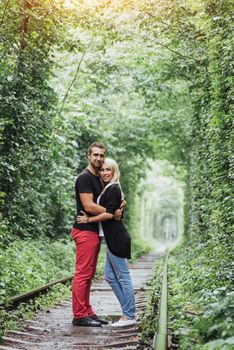 Loving couple on the iron road. Ukraine. Klevan