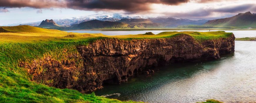 Reynisfjara black sand beach in Iceland. Reynisfyal Mountains