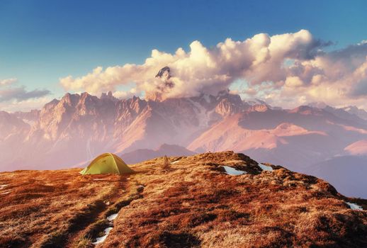 Tent green spread out on the pass Goulet. Georgia, Svaneti. Europe. Caucasus Mountains.