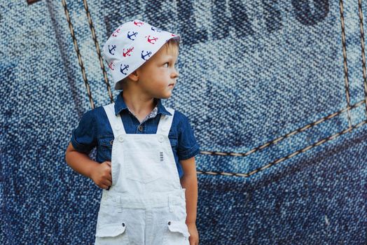 Cute boy posing for photo outdoors Ukraine. Europe.