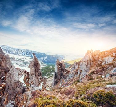 Colorful spring sunset over the mountain ranges in the national park Carpathians. Ukraine, Europe.