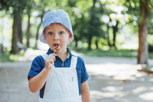 young boy with colorful lollipop. Ukraine. Europe