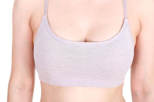 close up of a woman's chest in her sports bra